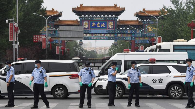 Chinese police guard the entrance to the closed Xinfadi market in Beijing on June 13th, 2020. Photograph: Greg Baker/AFP via Getty Images