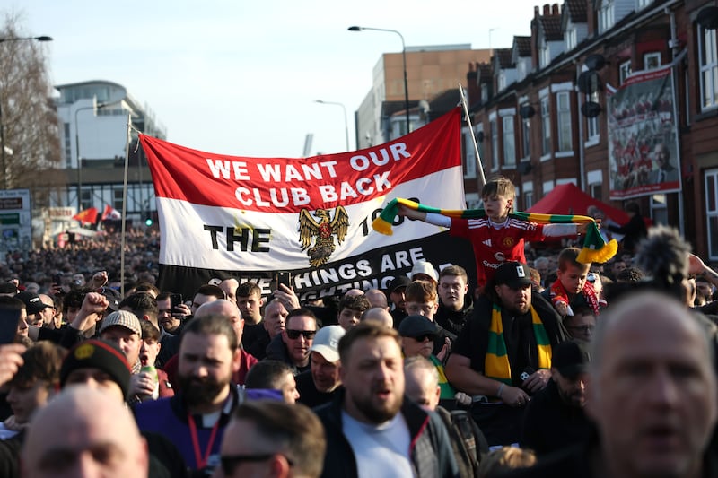 Manchester United fans protest ahead of the Premier League match against Arsenal at Old Trafford. Photograph: Carl Recine/Getty Images