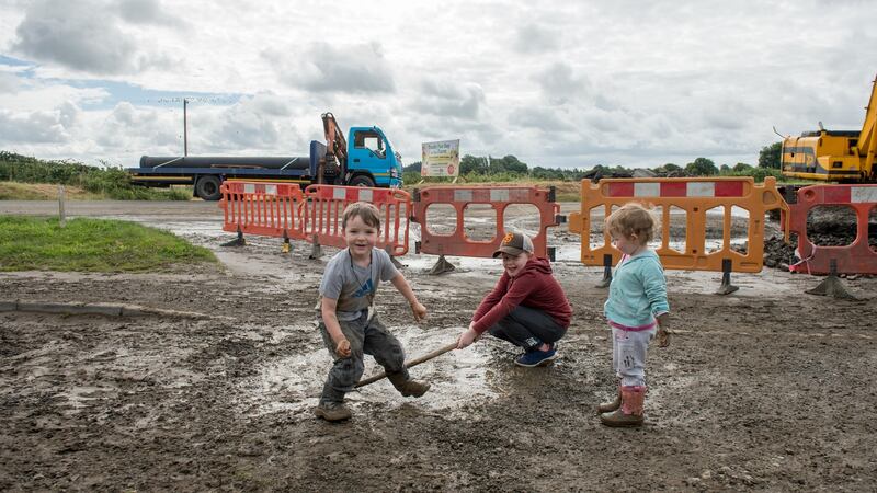 Children playing close to the site of a burst water pipe in Navan, Co Meath. Photograph: Barry Cronin