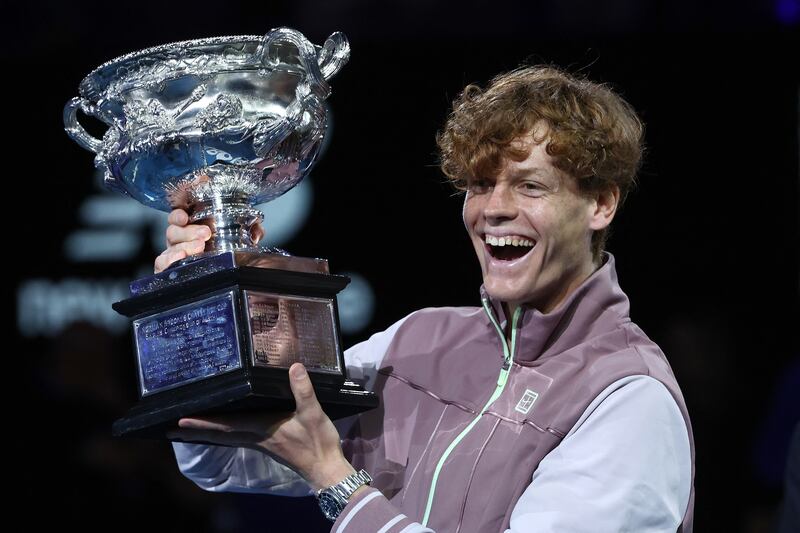 Italy's Jannik Sinner celebrates with the Norman Brookes Challenge Cup trophy after defeating Russia's Daniil Medvedev in 2024 Australian Open final. Photograph: David Gray / AFP