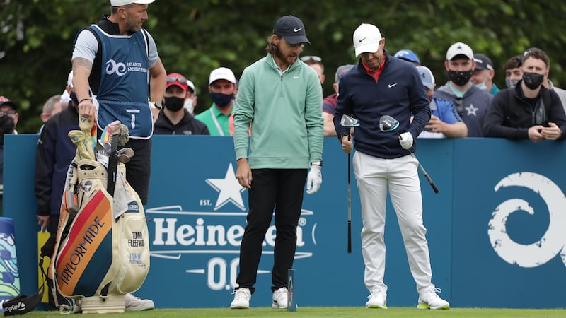 Fleetwood and McIlroy compare drivers on the 10th tee. Photo: Patrick Bolger/Getty Images