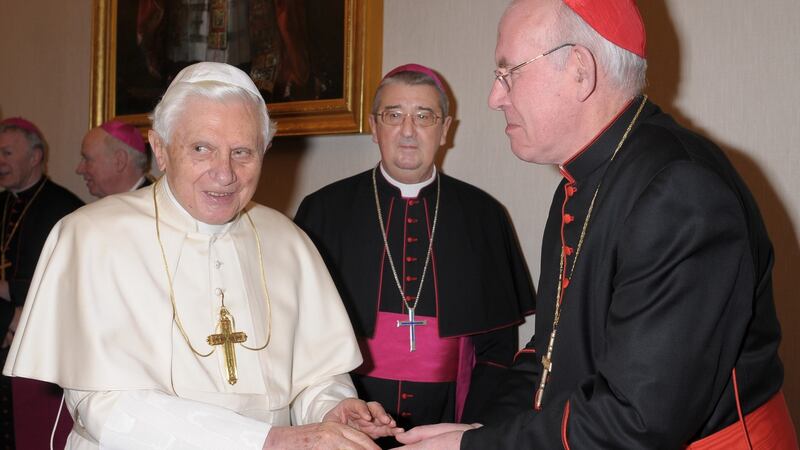 Pope Benedict is greeted by Cardinal Sean Brady, then Primate of All Ireland, and Archbishop Diarmuid Martin at the Vatican. Photograph: L'Osservatore Romano