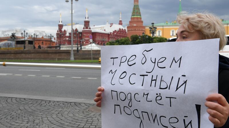 A placard reads “Demand fair signature counting” as a women protests against efforts to stop opposition candidates being registered for elections to the Moscow  Duma. Photograph: Kirill Kudryavtsev/AFP