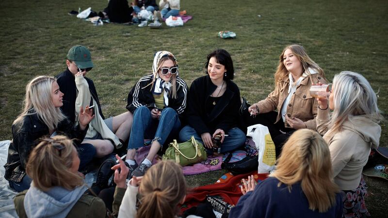 Students gather to drink and smoke at a park in Stockholm on April 23rd. Photograph: Andres Kudacki/New York Times