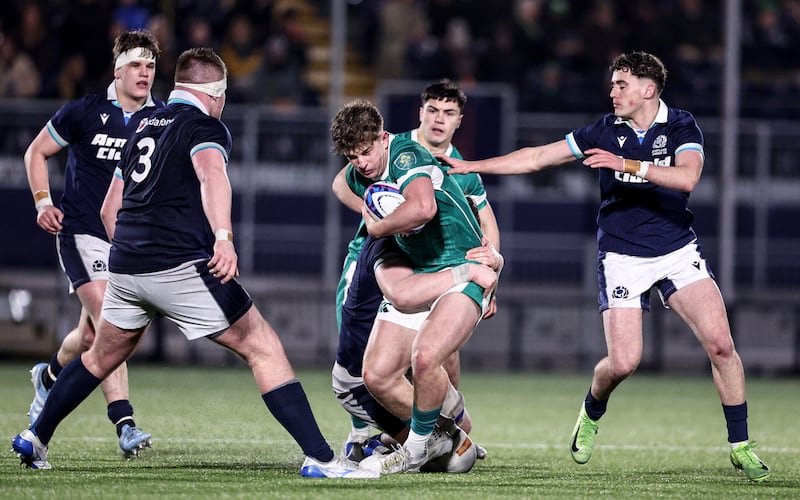 Ireland's Charlie Molony is tackled by Matthew Urwin of Scotland. Photograph: Ben Brady/Inpho