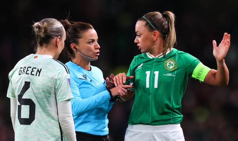 Referee Marta Huerta De Aza speaks with Wales’ Josephine Green and Katie McCabe of Ireland. Photograph: Ryan Byrne/Inpho