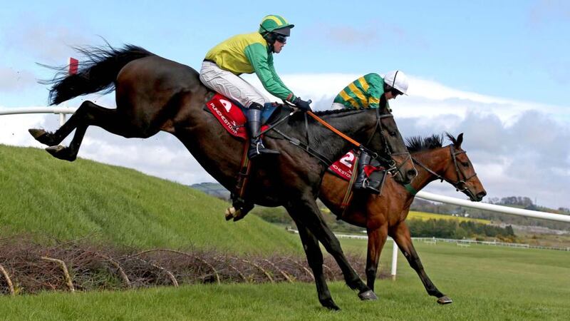 Wish Ye Didn’t ridden by Nina Carberry (far side) lands with  Elembridge King  on the way to winning the  KHC Fr Seán Breen Memorial Cross Country Chase  at Punchestown. Photo: Donall Farmer/Inpho