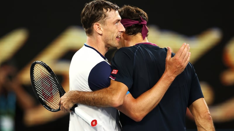 John Millman congratulates Roger Federer after his five-set win in Melbourne. Photograph: Cameron Spencer/Getty