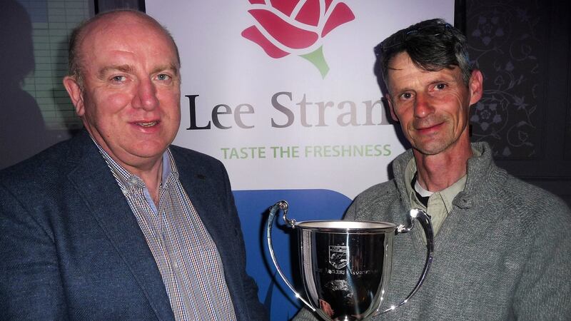 Gerry Dwyer, Lee Strand operations manager, presenting the Perpetual Cup to Charity winner, Pat Hoare.