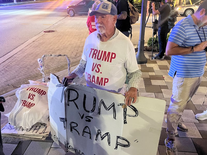 Bob Kunst, from Miami Beach, was selling ‘Trump vs Tramp’ T–shirts outside the Palm Beach County Convention Centre during Donald Trump's election watch party