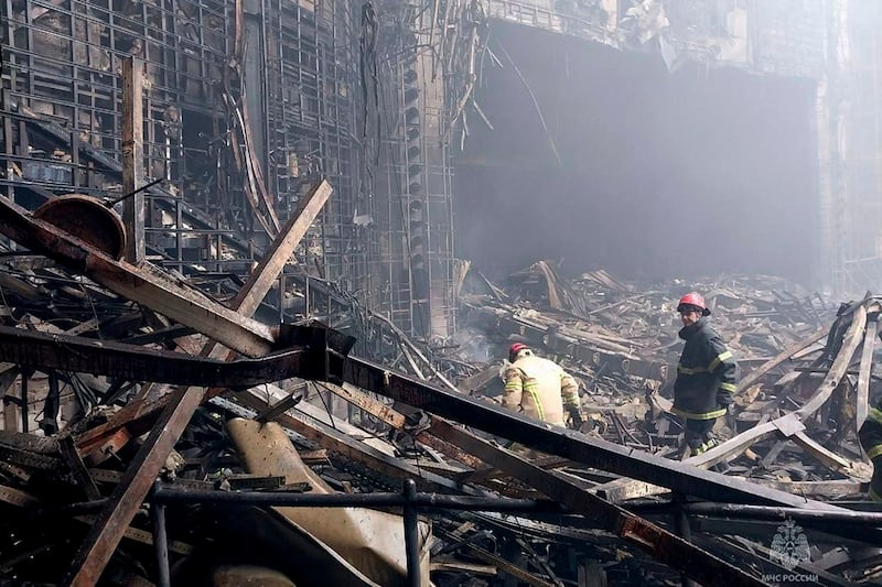 Firefighters work in the burned concert hall (Russian Emergency Ministry Press Service/AP)