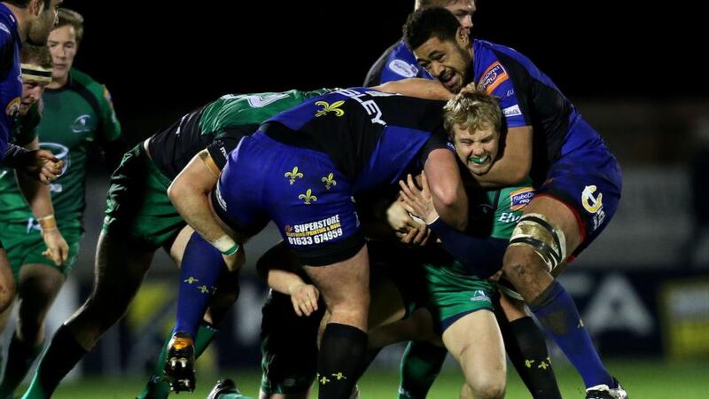 Owen Evans and Toby Faletau of the Dragons tackle Fionn Carr of Connacht at the Sportsground. Photograph: James Crombie/Inpho