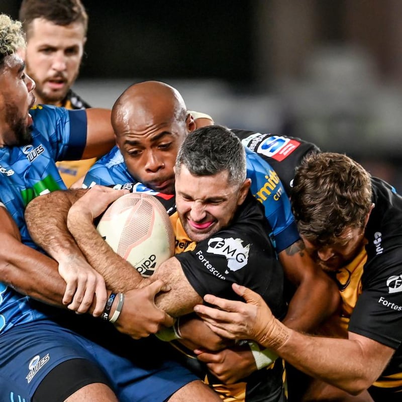 Western Force's Rob Kearney is tackled by Hoskins Sotutu and Mark Telea of the Blues, June 2021. Photograph: INPHO/Photosport/Andrew Cornaga