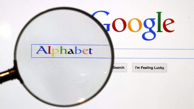 A Google search page is seen through a magnifying glass. Photograph: REUTERS/Pawel Kopczynski