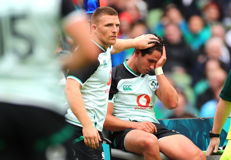 Ireland’s Andrew Conway checks on an injured Joey Carbery during the World Cup warm-up at the Aviva Stadium in August 2019. Photograph: James Crombie/Inpho