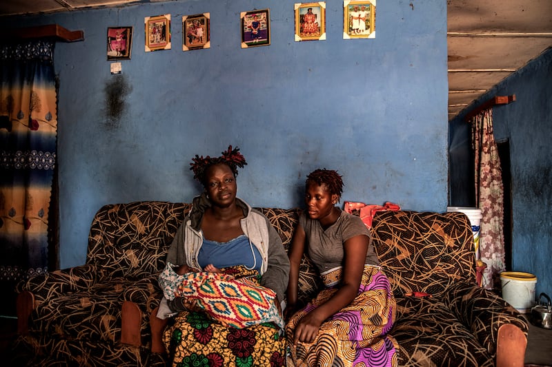 Seio Bangura (on right), with Kai Samura and her newborn in Kamakwie, Sierra Leone.