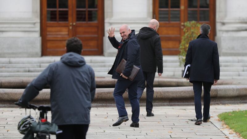 Dr Tony Holohan waves to leader of the Green Party Eamon Ryan as they arrive at Government Buildings on Monday afternoon.  Photograph: Nick Bradshaw/The Irish Times.