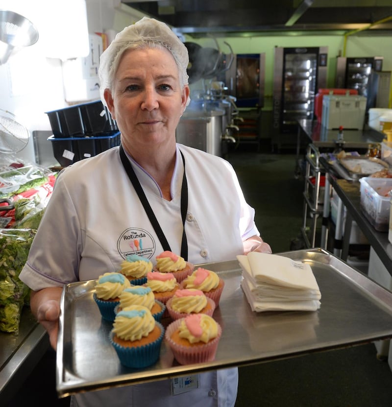 Christine Donohoe, ward catering supervisor with baby cakes made in the Rotunda Hospital. Photograph: Dara Mac Donaill / The Irish Times