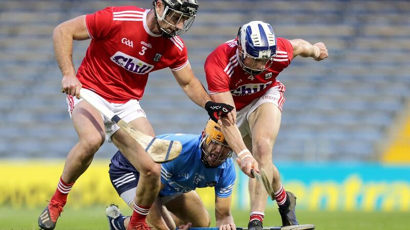 Dublin’s Eamonn Dillon with Colm Spillane and Seán O’Donoghue of Cork at Semple Stadium, Thurles, Co Tipperary on Saturday. Photograph: Laszlo Geczo/Inpho