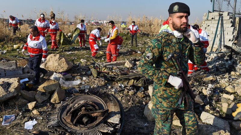 Rescue workers search the wreckage of a Boeing Co 737-800 aircraft, operated by Ukraine International Airlines, which crashed shortly after takeoff near Shahedshahr, Iran, on Wednesday. Photographer: Ali Mohammadi/Bloomberg