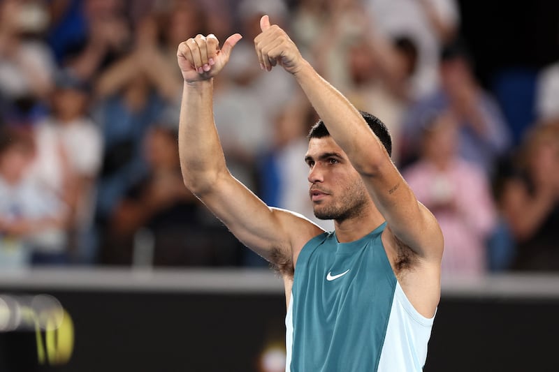 Spain's Carlos Alcaraz celebrates his victory against Kazakhstan's Alexander Shevchenko in the men's singles match on day two of the Australian Open tennis tournament in Melbourne on January 13, 2025. (Photo by Martin KEEP / AFP) / -- IMAGE RESTRICTED TO EDITORIAL USE - STRICTLY NO COMMERCIAL USE -- (Photo by MARTIN KEEP/AFP via Getty Images)