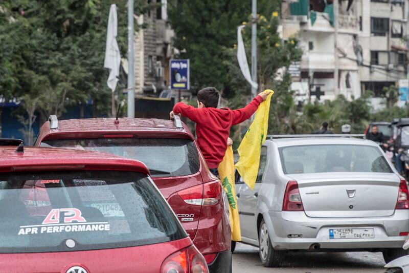 A child waves a Hizbullah flag during ceasefire celebrations in Dahiyeh, Beirut. Photograph: Sally Hayden