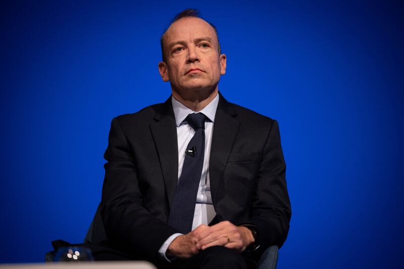 Britain's Secretary of State for Northern Ireland Chris Heaton-Harris speaks at the Conservative Party Conference in Birmingham, England