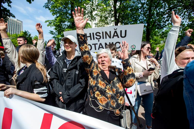 Supporters of the Shor political party protest in front of the parliament building in Chisinau, Moldova.