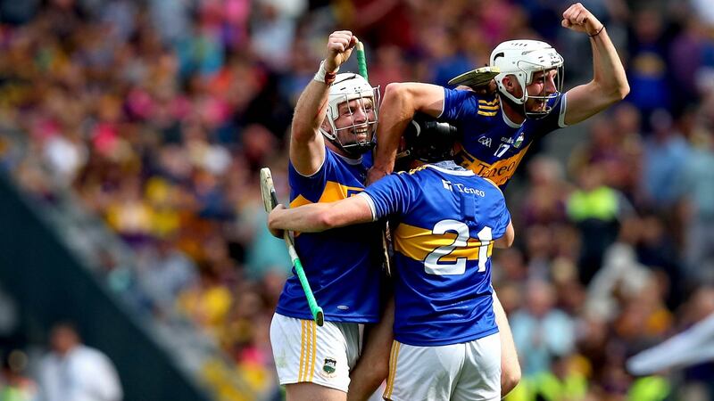 Tipperary’s Pádraic Maher, Alan Flynn and Ger Browne celebrate at the final whistle. Photograph: Ryan Byrne/Inpho