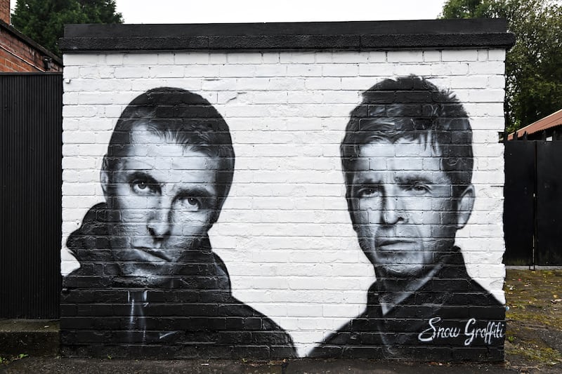 Liam and Noel Gallagher of Oasis featured on a Manchester mural. Photograph: Paul Ellis/AFP