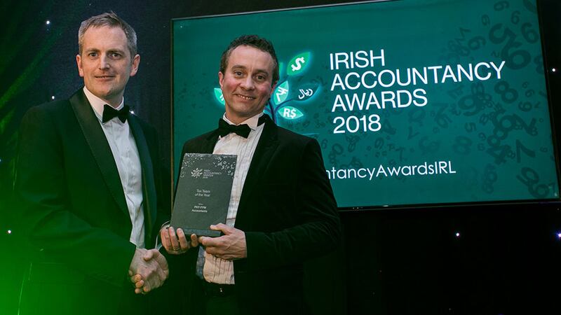 Gary Cullen, Head of Client Management, Harvest Financial Services presents the Tax Team of the Year award to Malachy McLernon, PKF-FPM Accountants.