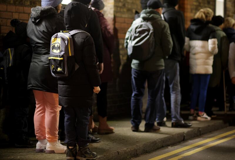 A boy lines up at the Capuchin Day Centre on Bow Street for Christmas food parcels. Photograph: Chris Maddaloni/The Irish Times