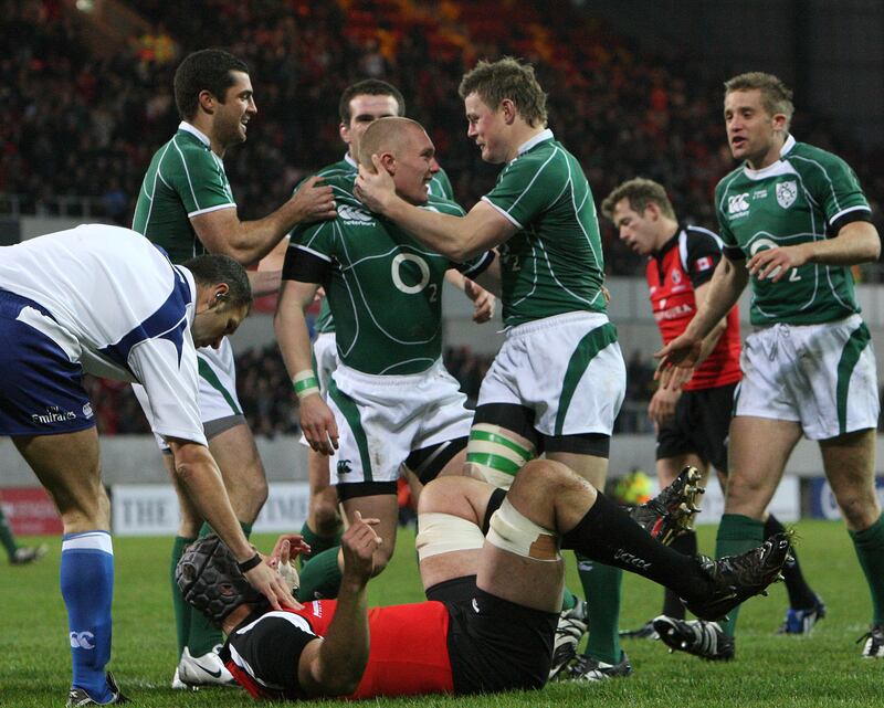 Keith Earls is congratulated by Brian O'Driscoll after scoring a try during his Test debut against Canada at Thomond Park in 2008. Photograph: Billy Stickland/Inpho 