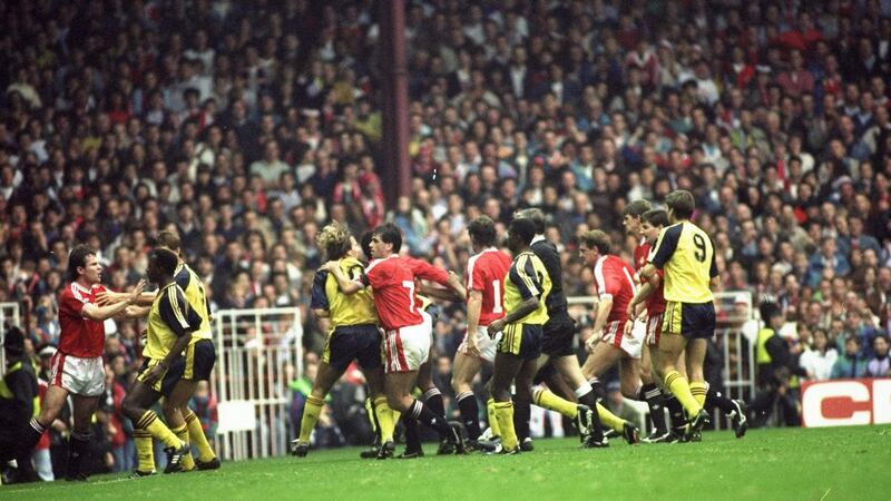 Manchester United and Arsenal players fight on the pitch   during Arsenal’s 1-0 win at Old Trafford  on  October 20th, 1990. Photograph: Russell Cheyne/Allsport