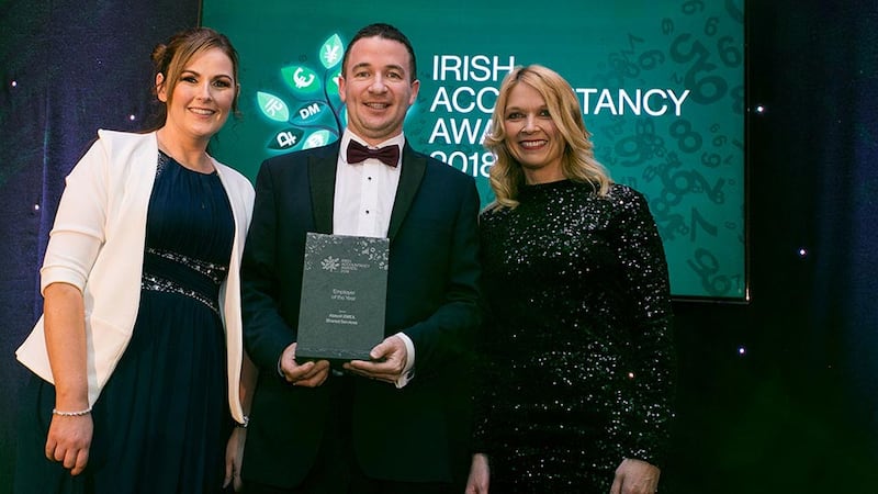 James Gallagher, Associate Director, Accounting Finance and Tax, Morgan McKinley presents the Employer of the Year award to Jennifer Dalton and Grace Winters, Abbott EMEA Shared Services