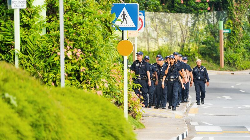 Police officers patrol the area around the Capella Hotel in Singapore on Monday. Photograph: Nicky Loh/Bloomberg