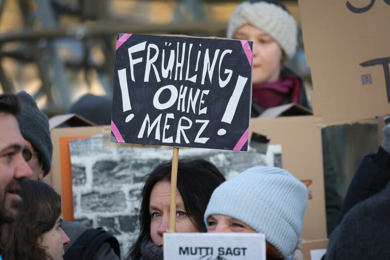 Protesters demonstrate outside congress centre WCCB in Bonn prior to the arrival of Friedrich Merz. Photograph: Andreas Rentz/Getty 