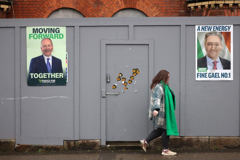 Campaign signs for Fianna Fáil and Fine Gael seen on election day at in front of an abandoned house in Cabra. Photograph: Chris Maddaloni