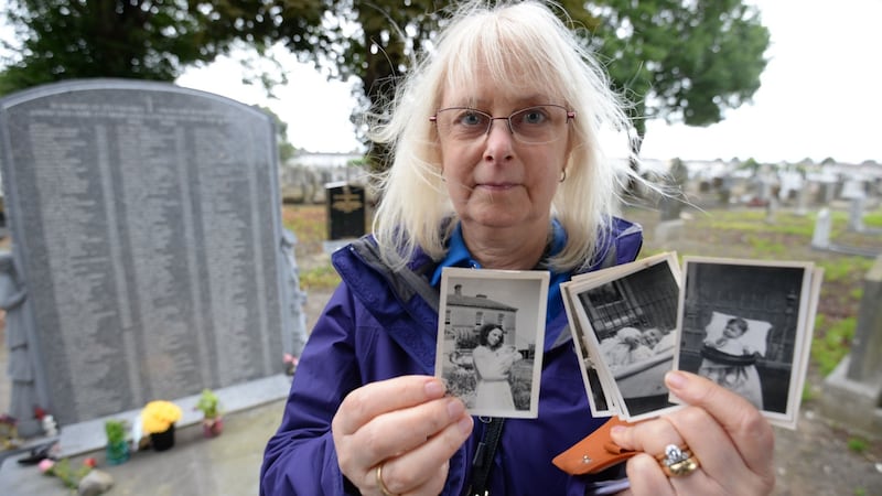 Joyce McSharry holding photographs of herself as a baby with her mother Emily Sheppy  at the Bethany Home in 1951, where she spent the first six and a half months of her life before she was adopted. Joyce was attending an annual remembrance at Mount Jerome cemetery for children who lost their lives at the home. Photograph: Alan Betson/The Irish Times