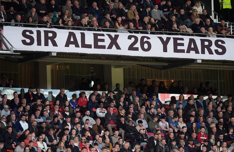 A banner supporting former Manchester United manager Alex Ferguson after the termination of his ambassadorial contract with the club. Photograph: Martin Rickett/PA