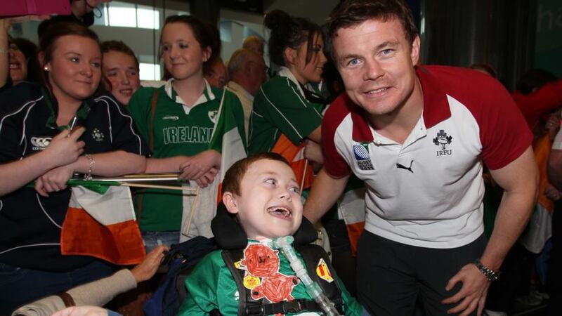 Matthew McGrath from Wexford meets his hero Brian O’Driscoll at Dublin Airport in 2011 as the Irish rugby team returned from   New Zealand. Photograph:  Colin Keegan/Collins, Dublin