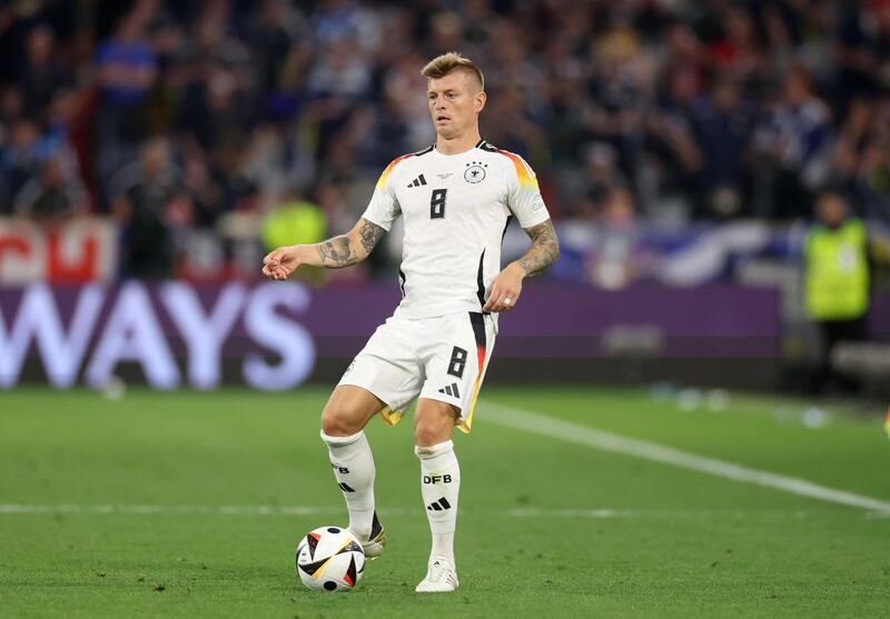 Toni Kroos of Germany passes the ball against Scotland. Photograph: Lars Baron/Getty