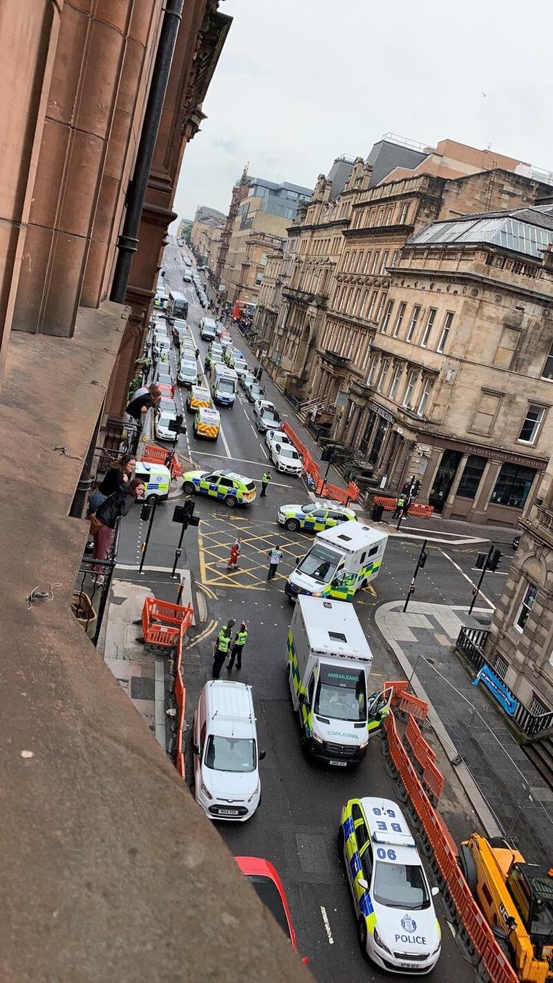 Photo taken with permission from the Twitter feed of @Milroy1717 of emergency services presence in West George Street, Glasgow, as a serious police incident has closed roads in the city centre. Photograph: @Milroy1717/PA Wire