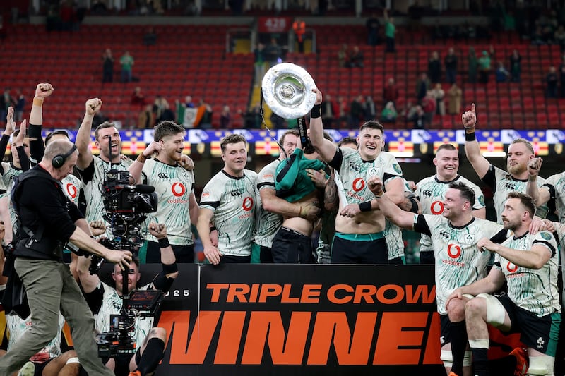 Ireland players celebrate their Triple Crown win in Cardiff. Photograph: Michael Steele/Getty Images