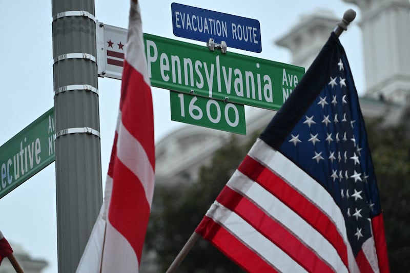 The flag of the District of Columbia and US flag outside the White House in Washington, DC on Sunday. Photograph: Roberto Schmidt/ AFP via Getty Images