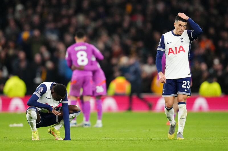 Tottenham Hotspur's Pape Matar Sarr (left) and Pedro Porro dejected at the final whistle. Photograph: John Walton/PA