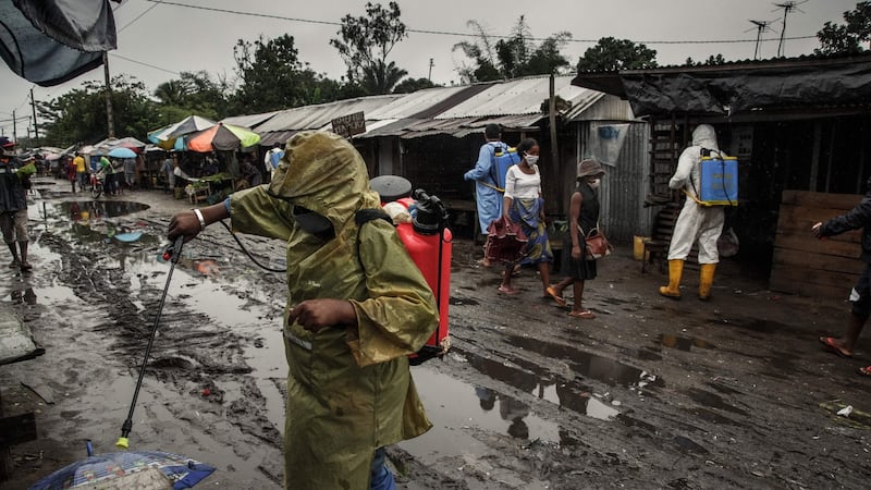 Ministry of Health officials spray a market in Toamasina, a major port city on Madagascar’s east coast, on Thursday. Photograph:  Rijasolo/AFP