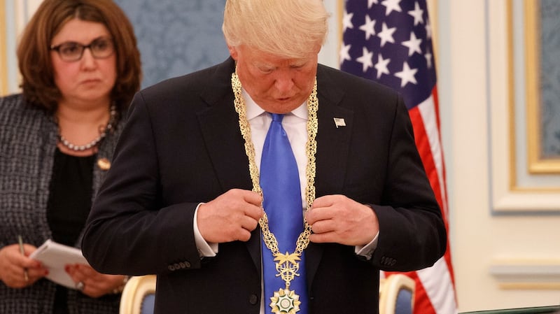 US president Donald Trump looks at a medal given to him by King Salman bin Abdulaziz, in Riyadh. File photograph: Evan Vucci/AP Photo