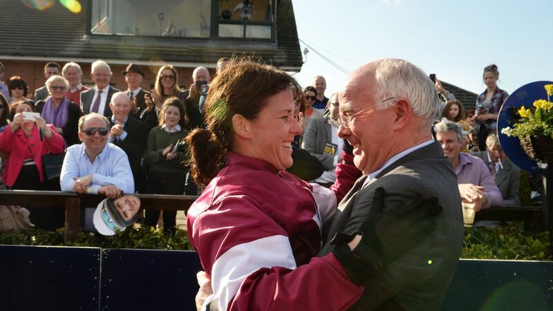 Katie Walsh celebrates with her father Ted after winning the Irish Grand National on Thunder and Roses. Photograph: Cyril Byrne/The Irish Times