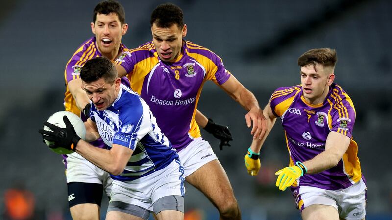 Kilmacud’s Craig Dias with Eamonn Callaghan of Naas. Photograph: Ryan Byrne/Inpho